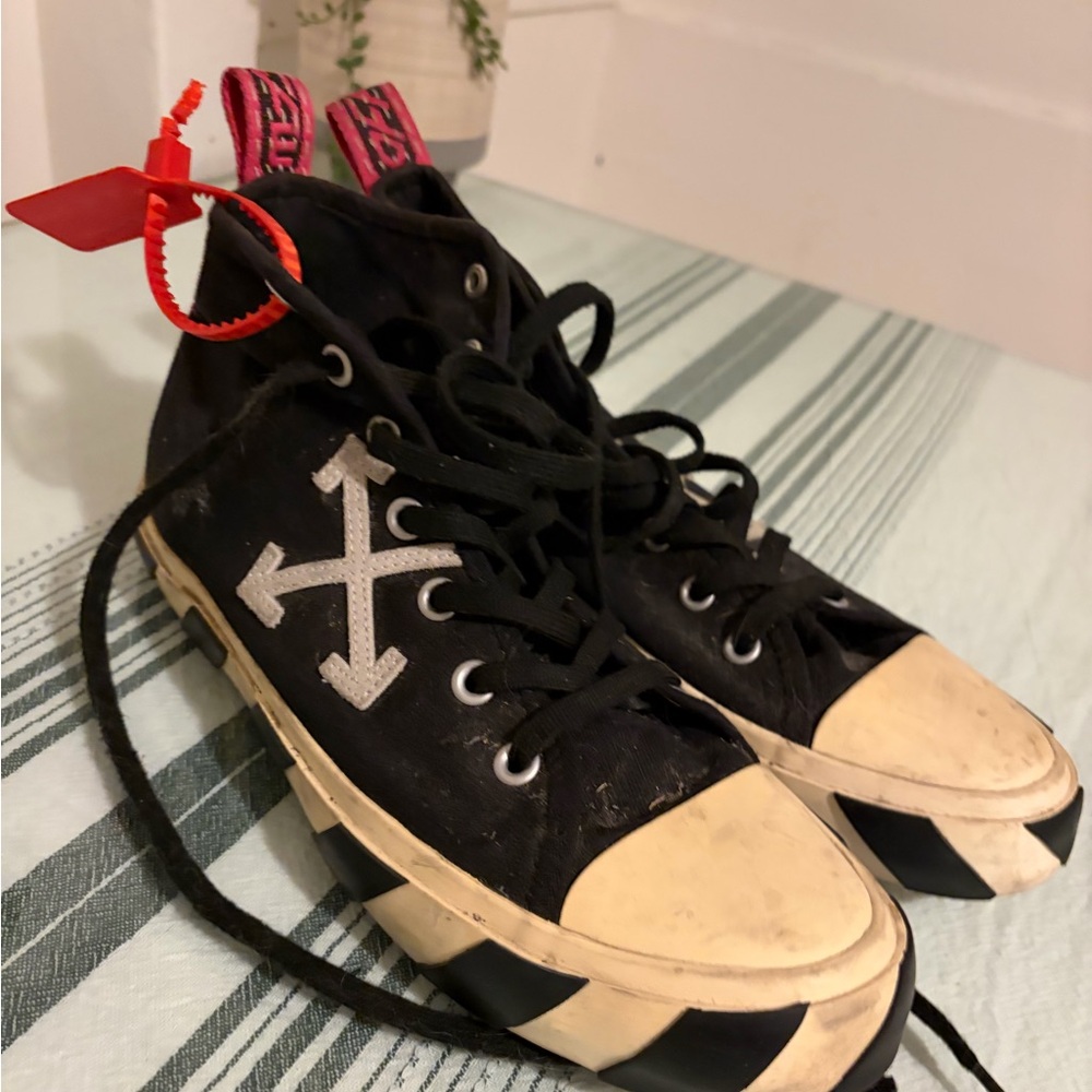 Black High-Top Sneakers with White Arrows